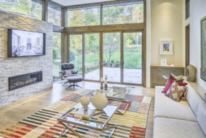 A large living room with sliding aluminum patio doors