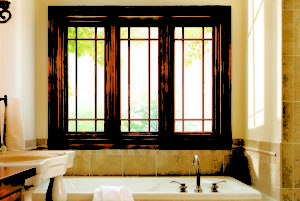 Series of three rectangular windows above bathtub 